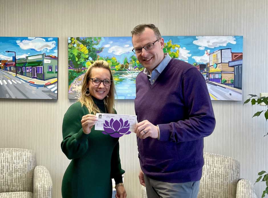 Melanie Black of Main Street Barberton stands with Josh Gordon